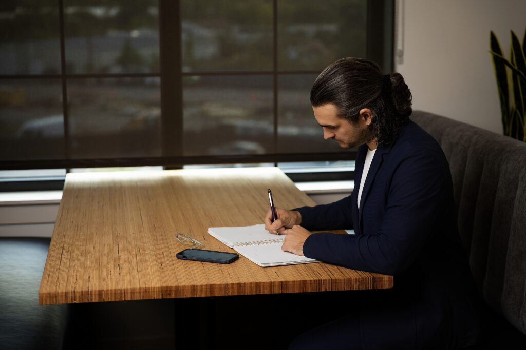 Dylan James Writing on Document